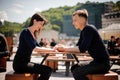 Young, happy couple smiling and holding hands across the table at a restaurant. Royalty Free Stock Photo