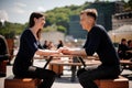 Young, happy couple smiling and holding hands across the table at a restaurant. Royalty Free Stock Photo