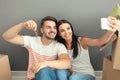 Young happy couple taking selfie with house key at new home Royalty Free Stock Photo