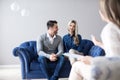 Young happy couple after therapy session with family psychologist Royalty Free Stock Photo