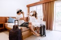 Young happy couple traveler with luggage at the hotel room Royalty Free Stock Photo