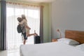 Young happy couple traveler with luggage at the hotel room Royalty Free Stock Photo