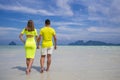 Young happy couple on tropical beach at summer vacation. Thailand