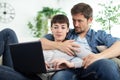 young happy couple using pc at home Royalty Free Stock Photo
