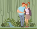 Young happy couple on a walk in jungle forest or park. Romantic date. The man gave the girl his jacket. Embracing lovers Royalty Free Stock Photo
