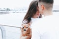 Young happy couple on walk with small dog Royalty Free Stock Photo