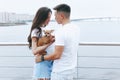 Young happy couple on walk with small dog Royalty Free Stock Photo