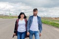 Young and happy couple walking down the street Royalty Free Stock Photo