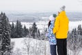 Young happy couple walking in winter park