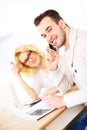 Young happy couple working on documents at home Royalty Free Stock Photo