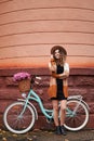 Beautiful girl on the street with woman& x27;s retro bicycle. Royalty Free Stock Photo