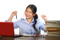 Young happy and cute Asian Chinese teenager student smiling happy working and studying with texbooks and laptop computer sitting Royalty Free Stock Photo