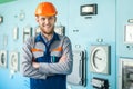 Young happy engineer at control room