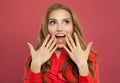 Young happy excited surprised woman with opened mouth on colorful bright pink background. Positive emotion. Royalty Free Stock Photo