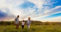 Young happy family in a field