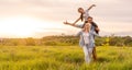 Young happy family in a field