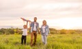 Young happy family in a field