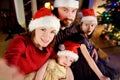 Young happy family of four taking a photo of themselves on Christmas Royalty Free Stock Photo