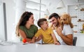 Young happy family having fun, being playful at home Royalty Free Stock Photo