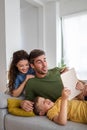 Young happy family having fun, being playful at home Royalty Free Stock Photo