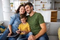 Young happy family having fun, being playful at home Royalty Free Stock Photo