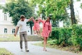 Young happy family with little beautiful baby with blue eyes walking in summer park at sunset. Mom and little daughter Royalty Free Stock Photo