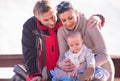 Young happy family with little child enjoying winter day Royalty Free Stock Photo