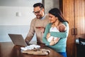 Young family, parents with baby shopping online on laptop with credit card at home. Online shopping Royalty Free Stock Photo