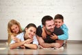 Young happy family parents and two children home studio Royalty Free Stock Photo