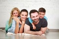 Young happy family parents and two children home studio Royalty Free Stock Photo