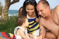 Young happy family playing outdoors Royalty Free Stock Photo