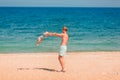 Young happy father playing with his baby at the beach Royalty Free Stock Photo