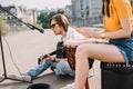 Young happy female drummer and male guitarist Royalty Free Stock Photo