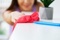 Young Happy Female Janitor Cleaning Desk With Rag In Office Royalty Free Stock Photo