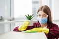 Young Happy Female Janitor Cleaning Wooden Desk With Rag In Office Royalty Free Stock Photo