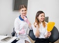 Young happy female patient checking their teeth at mirror after dental procedure in dental office. Dentistry Royalty Free Stock Photo