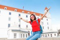 Happy female tourist in Bratislava city near Castle or Hrad. Travel in Slovakia and Europe Union concept