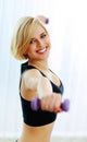 Young happy fit woman with dumbbells Royalty Free Stock Photo
