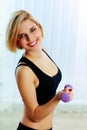 Young happy fit woman holding dumbbells Royalty Free Stock Photo