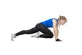 Young happy fitness lass wearing pink sportswear doing press-up, isolated on white