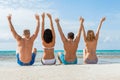 Young happy friends havin fun on the beach