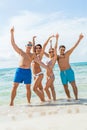 Young happy friends havin fun on the beach