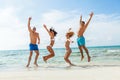 Young happy friends havin fun on the beach