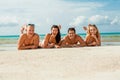 Young happy friends havin fun on the beach