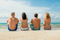 Young happy friends havin fun on the beach