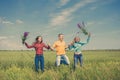 Young happy Friends running on green wheat field Royalty Free Stock Photo