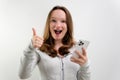 Young happy fun secretary employee business woman in casual shirt work stand at white office desk with pc laptop hold Royalty Free Stock Photo