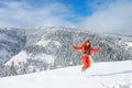 A young happy girl enjoys beauty of winter landscape near beautiful lake Amut in taiga hills on Far East of Russia in