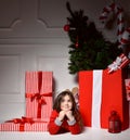 Young happy girl looking at the corner smiling near christmas bi Royalty Free Stock Photo