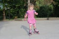 Young happy girl riding roller blades Royalty Free Stock Photo